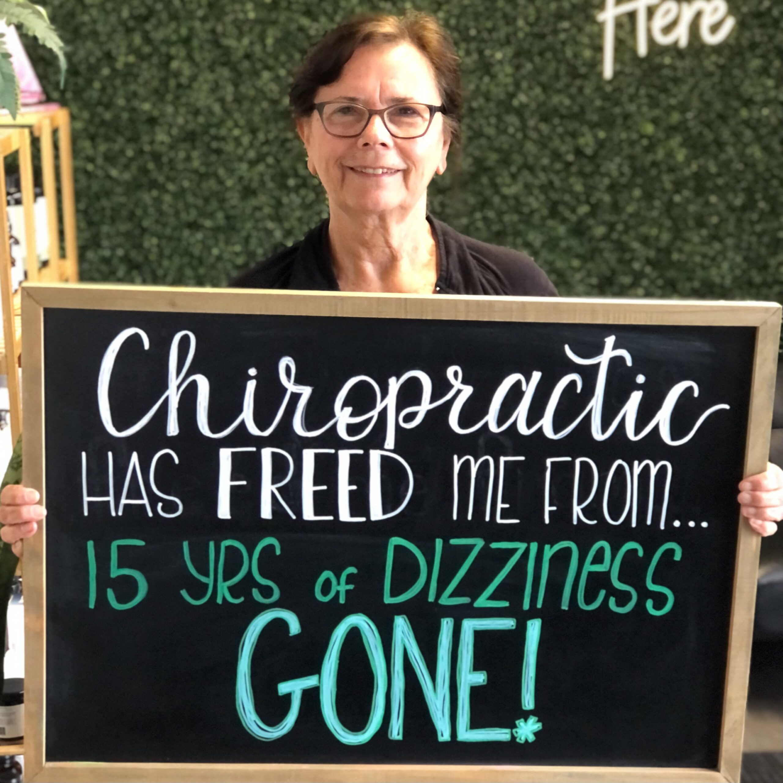 Legacy Family Chiropractic patient sharing a chalkboard health story