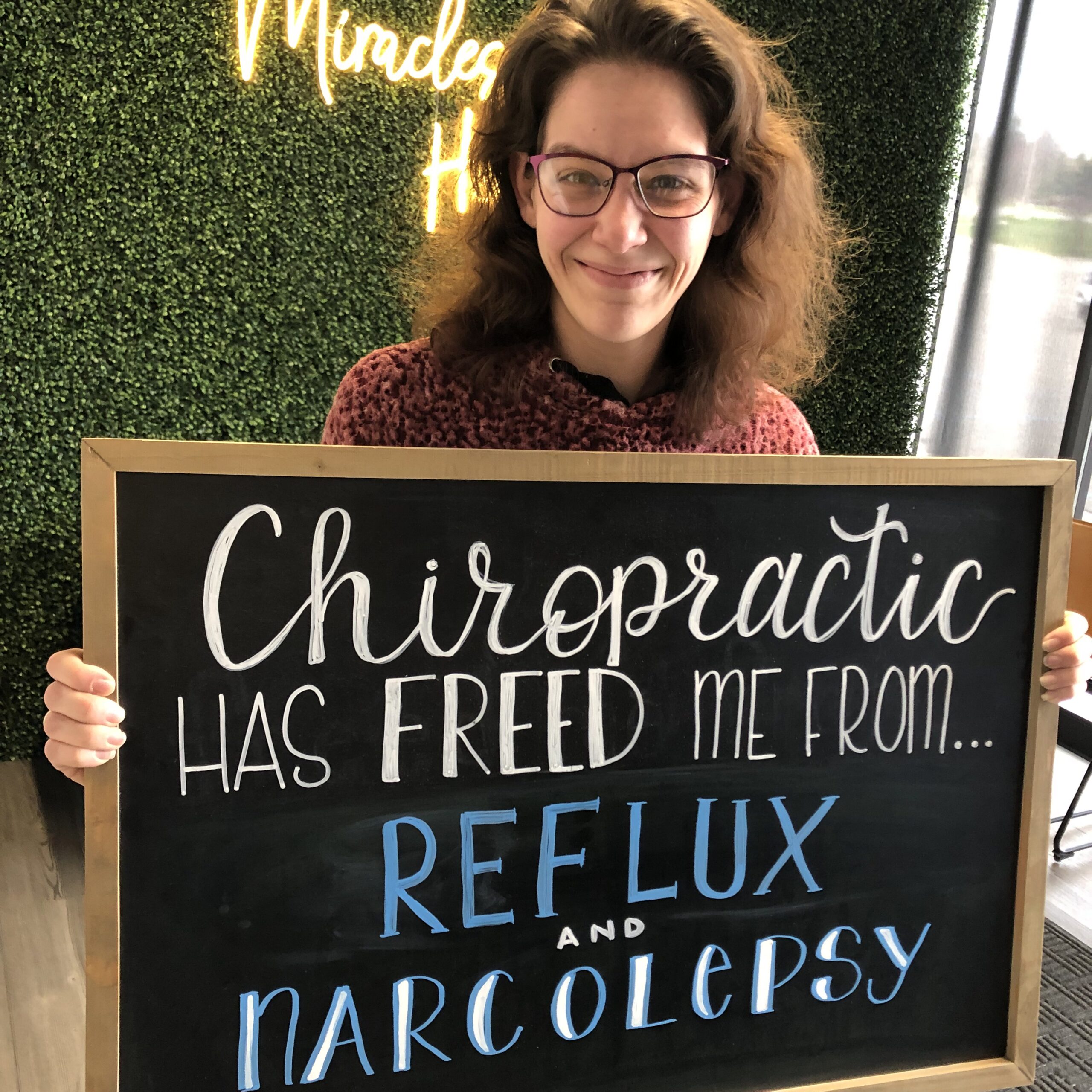 Legacy Family Chiropractic patient sharing a chalkboard health story