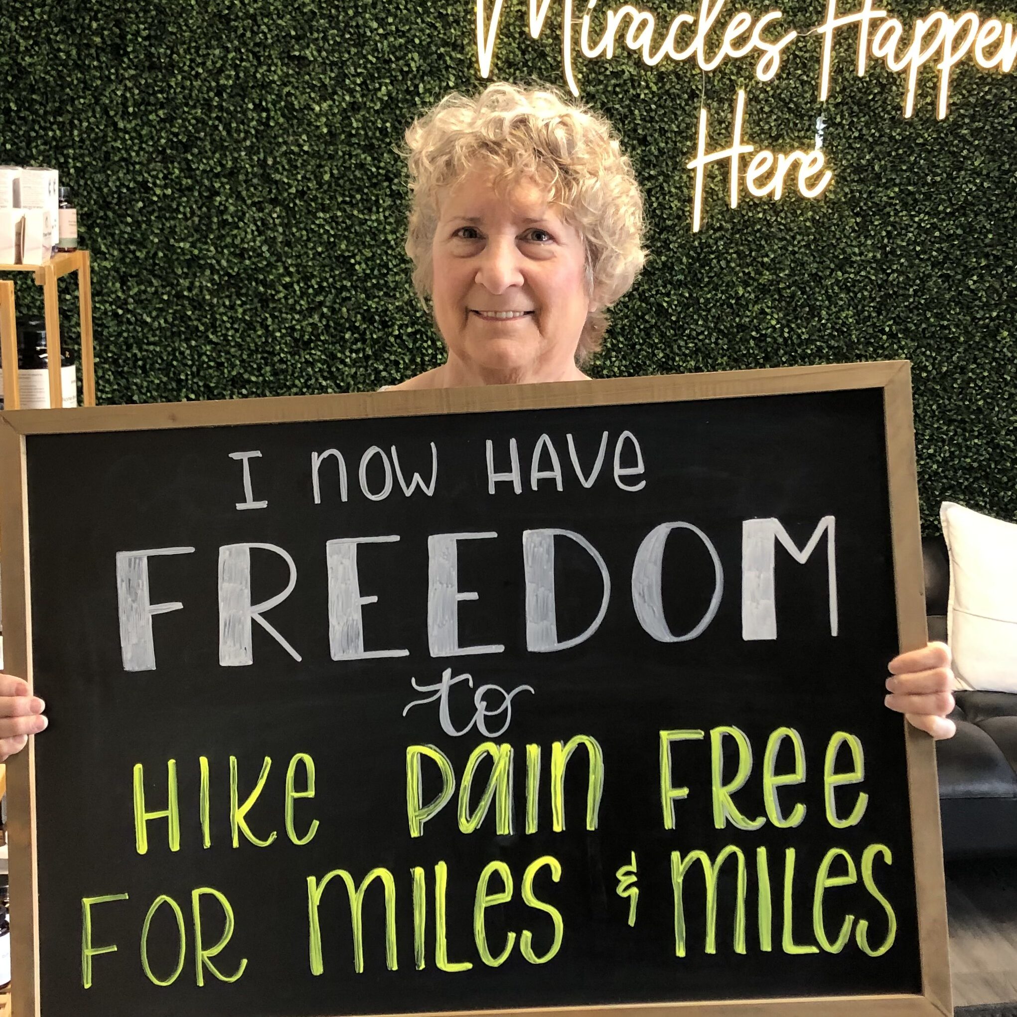 Legacy patient sharing newfound freedom on a chalkboard