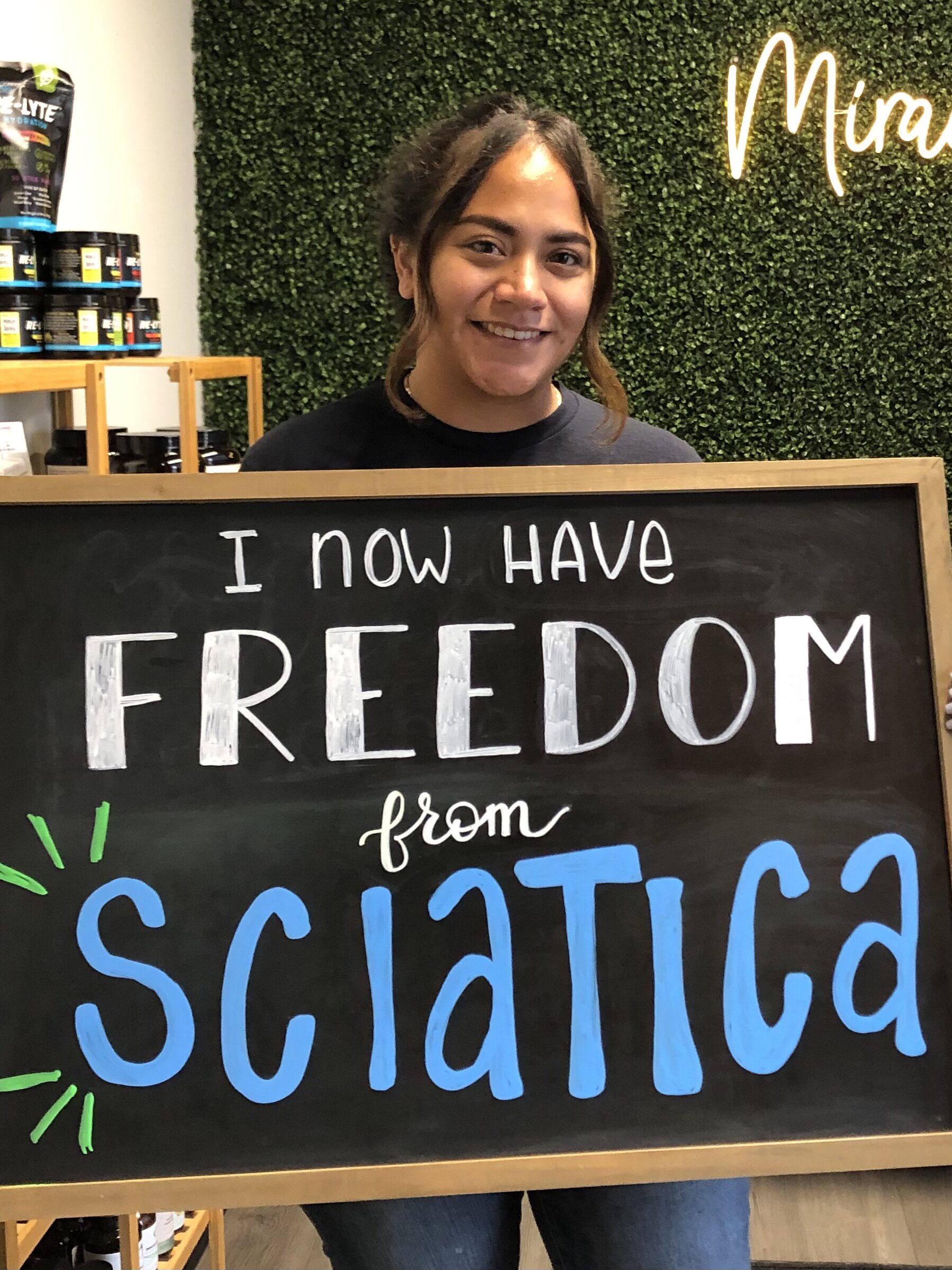 Legacy Family Chiropractic patient sharing a chalkboard health story