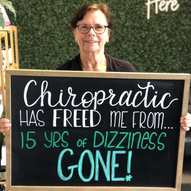 Legacy Family Chiropractic patient sharing a chalkboard health story