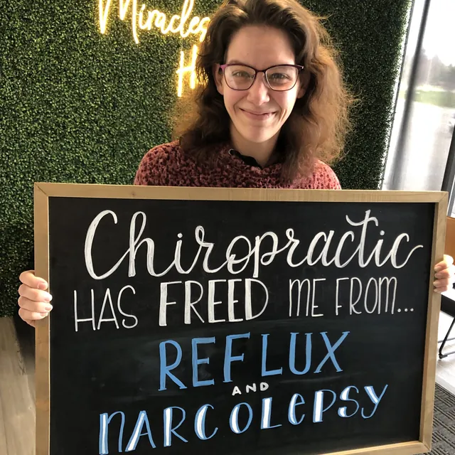 Legacy Family Chiropractic patient sharing a chalkboard health story